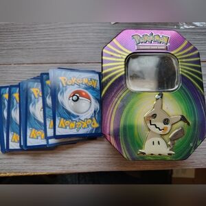 Pokemon cards and tin.